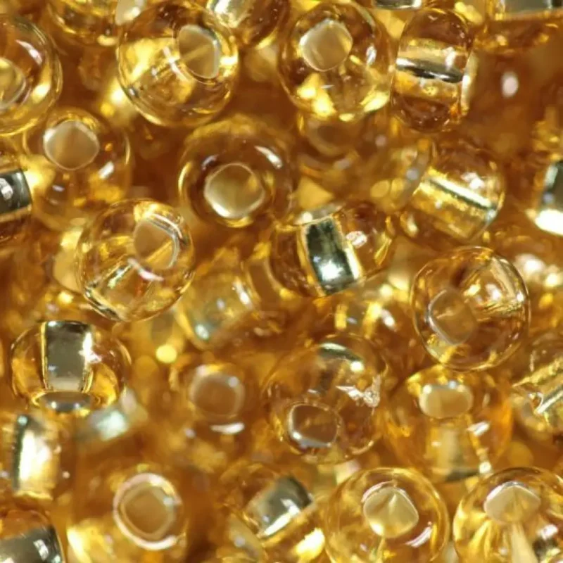 17020 10/0 чеський бісер Preciosa,  золото, прозорий з блискучим срібним отвором