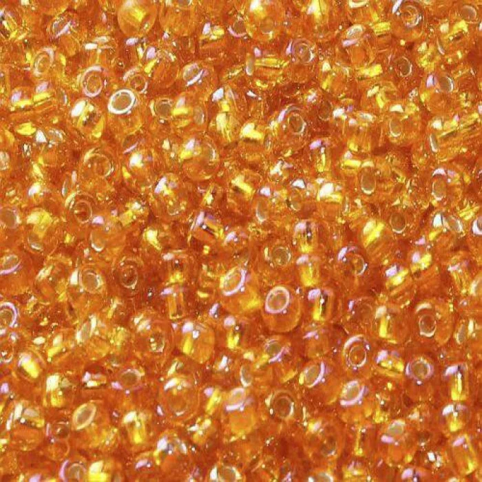 87069 10/0 чеський бісер Preciosa, помаранчевий, прозорий райдужний з блискучим срібним отвором