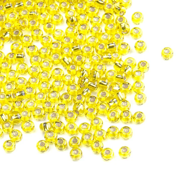 87010 10/0 чеський бісер Preciosa, жовтий, прозорий з блискучим срібним отвором