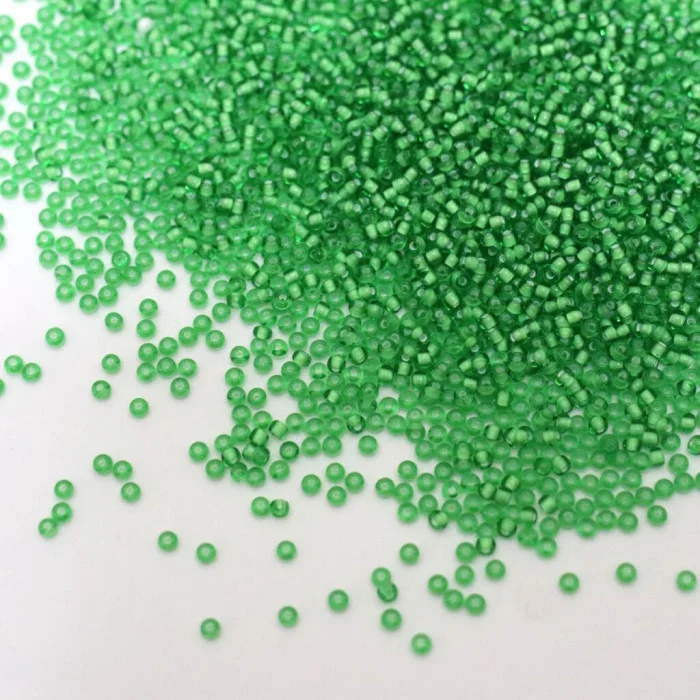 55106 10/0 чеський бісер Preciosa,  світло-зелений, прозорий з білим отвором